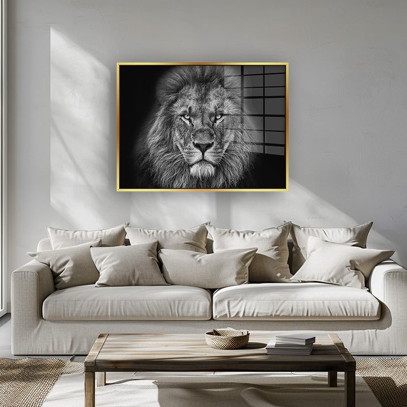 Lion black and white painting in a gold frame inside