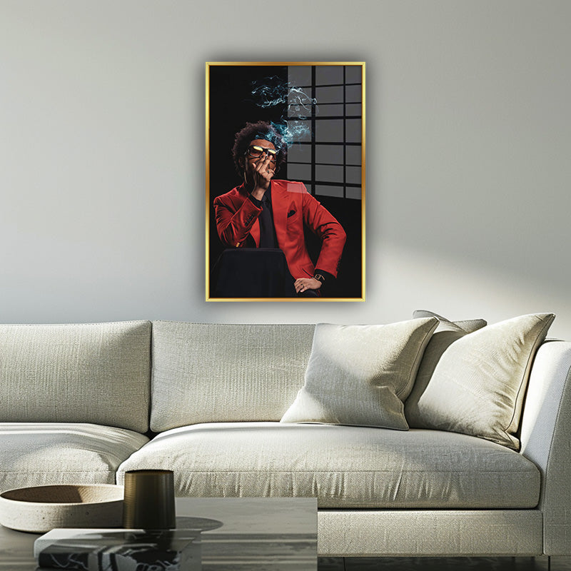 The Weeknd painting in a gold frame inside