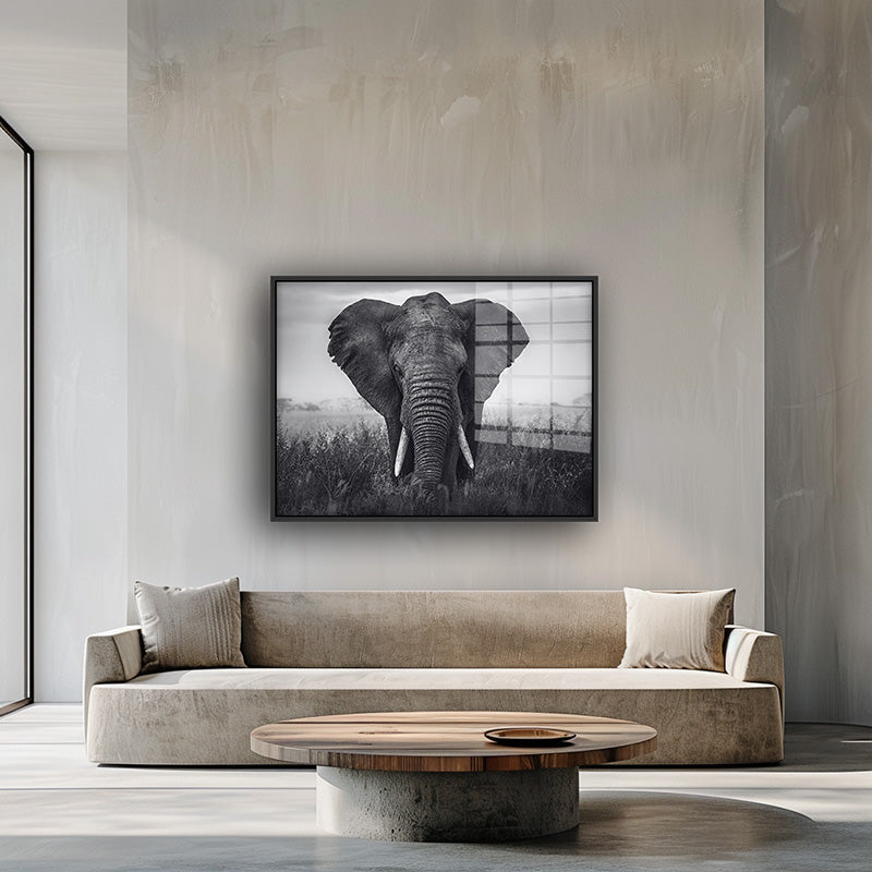 Painting of African elephant in a black frame inside