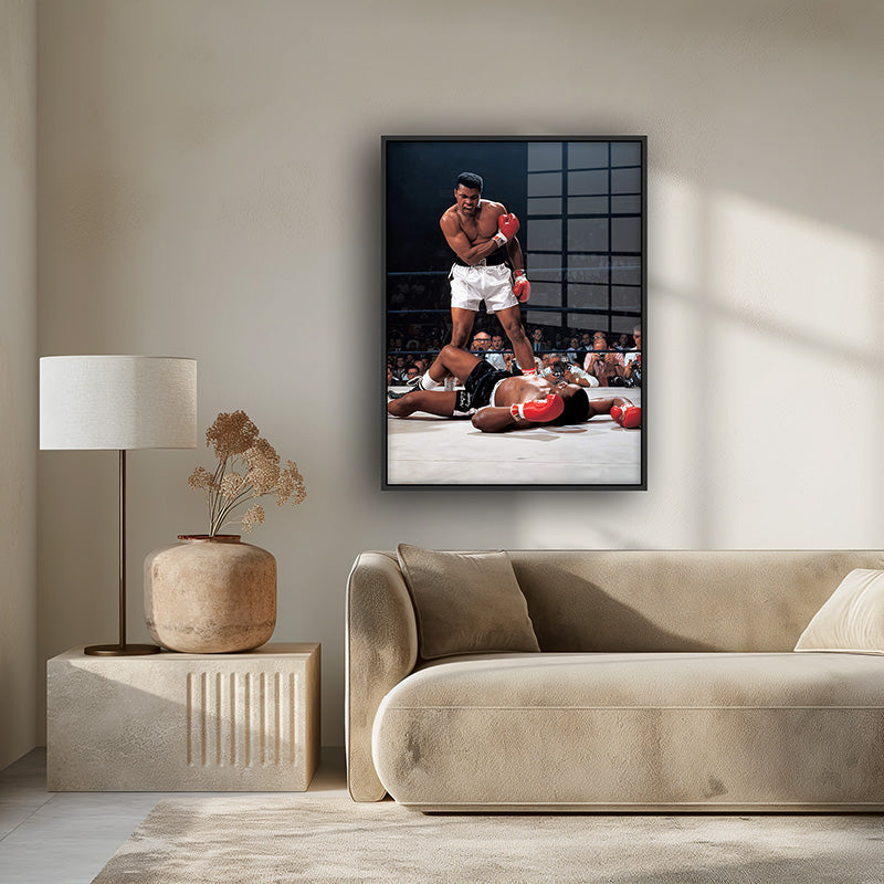 Painting of Ali vs Tyson in a black frame inside