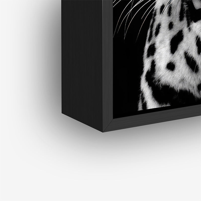 Painting of baby panther in a black frame closeup