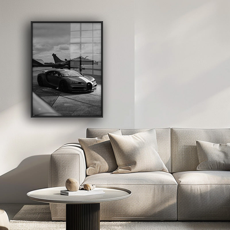 Painting of Bugatti on an airway in a black frame inside