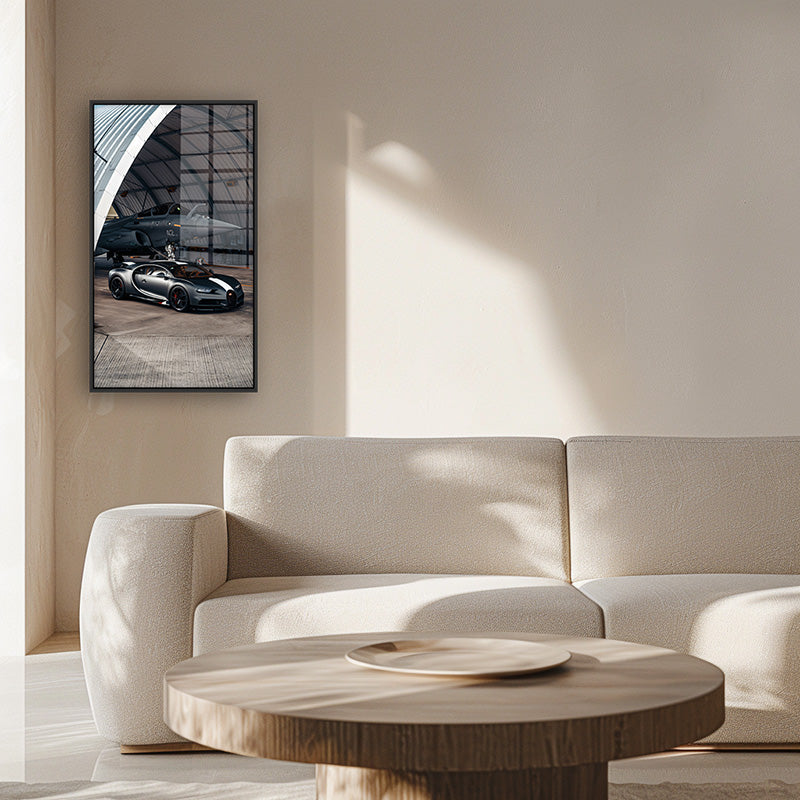 Painting of bugatti jet in a black frame inside