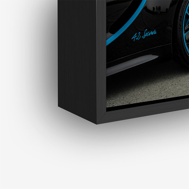 Painting of Bugatti plane in a black frame closeup