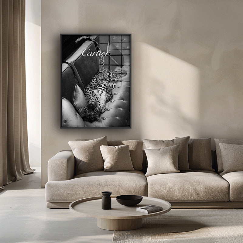 Painting of Cartier panther in a black frame inside