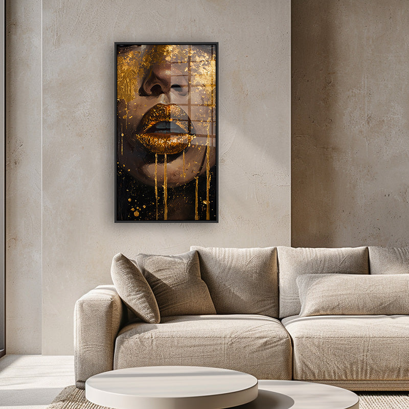 Painting of golden lips in a black frame inside