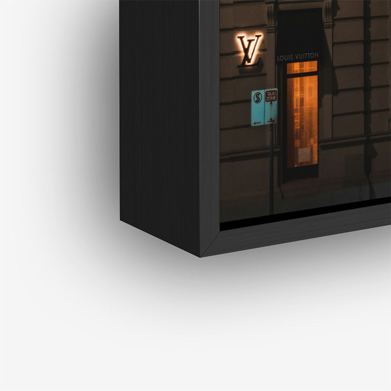 Painting of Louis Vuitton store in a black frame closeup