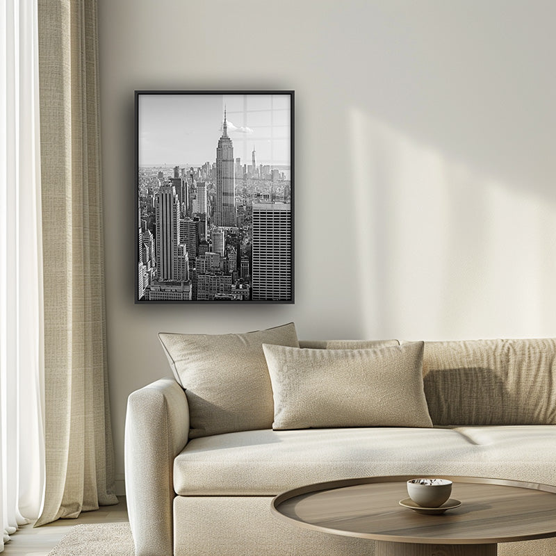 Painting of Manhattan in a black frame inside