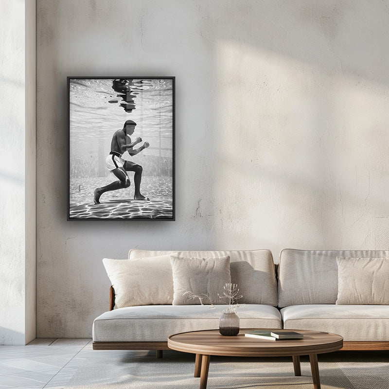 Painting of Muhammad Ali in a black frame inside